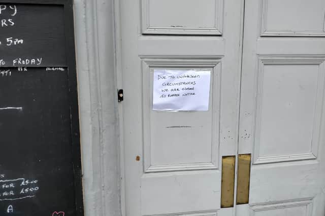 A notice taped to the entrance of The London Inn pub, in Cannon Street.
