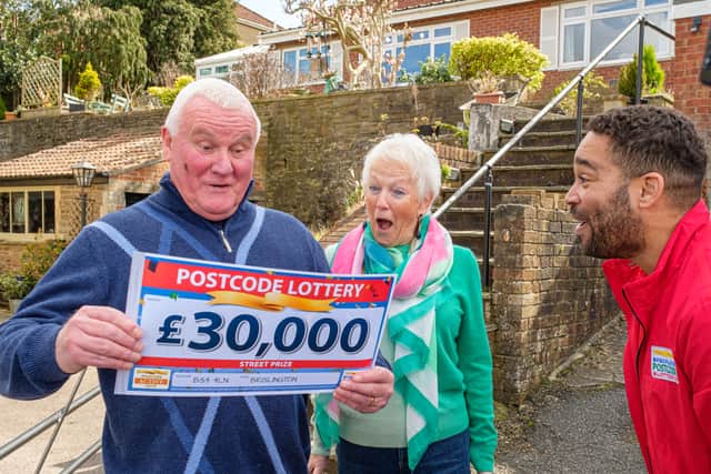 David Roman and wife Jackie with Danyl Johnson celebrate on winning the £30k