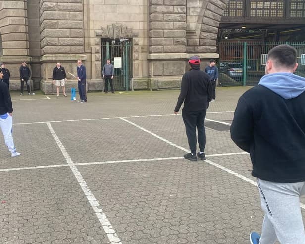 The cricketers passing the time at Dover with an impromptu match (Photo: SWNS)