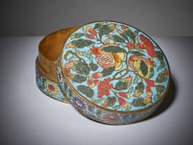 An exceptionally rare Chinese box and cover from the 15th century Ming period has been discovered in a dust-filled cabinet in the attic of a family home, where it had been stored and left untouched since the owner’s death in 1967.