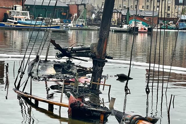 The remains of a boat which has been submerged by water after the fire at the Underfall Yard (Photo credit: Andrew Cleaver)