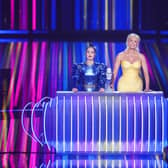 Eurovision hosts Julia Sanina and Hannah Waddingham with the Eurovision trophy