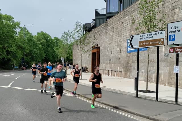 Runners turn the corner toward Queen Square in the Great Bristol Run 2023
