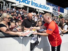 Ex Man U player Paul Scholes signs autographs.