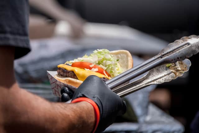 Stock image of a burger being served from a van - hygiene inspectors found failings at Alex Burger Van