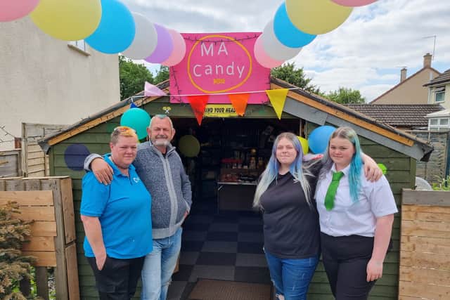 Alison, Mike, Tyra and Iona outside their sweet shop in a garden shed