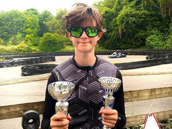 14-year-old Lauren Dunleavy with her trophies at Castle Combe race track