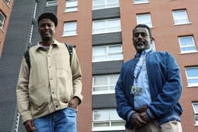 Khalil Abdi (left) from the Bristol Horn Youth Concern and Cllr Yassin Mohamed outside the flat building. A man died and eight people were taken to hospital after a fire ripped through the Bristol tower block