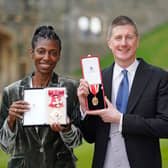 Sharon White poses with her award after she was made a Dame CBE, for public service, next to her husband Sir Robert Chote (Photo by Andrew Matthews - WPA Pool/Getty Images)