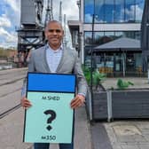 Mayor Marvin Rees with a M Shed Monopoly card