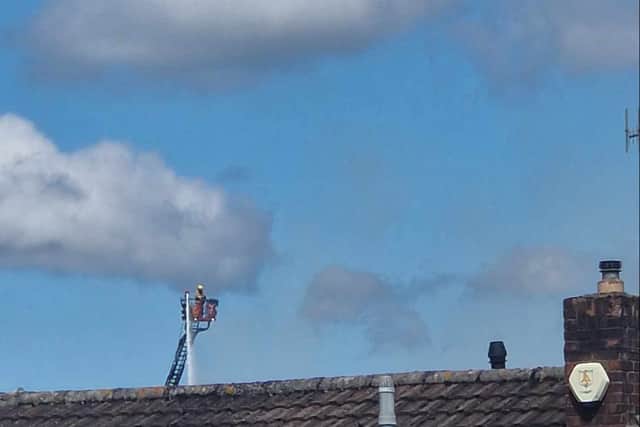 A firefighter tackles the blaze at Whitchurch Sports Centre (Photo credit: Marie Barnes)