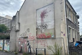 The wall where Banksy’s Valentine’s Day artwork has been tagged repeatedly with the term ‘Robbo'