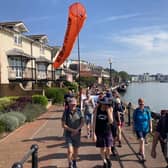 Bristol Airport expansion campaigners walk through the harbourside on their protest pilgrimage 