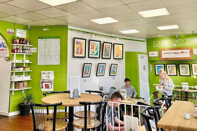 The cafe has a retro look and local art on the walls