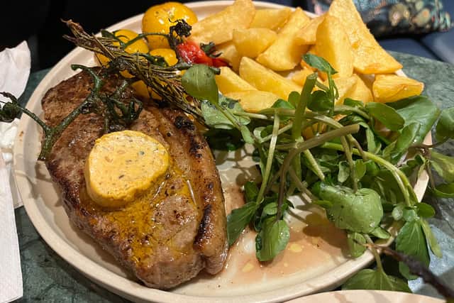 The 10oz West Country sirloin steak with cafe de Paris butter, triple-cooked chips, cherry vine tomatoes and watercress