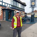 Jody Kamali as his alter ego Terry the Odd Job Man outside his local pub in Southmead