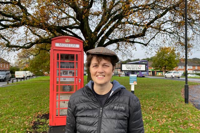 Local leader Mary Milton outside the Sea Mills Museum housed in an old phone box