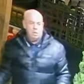 Police want to speak to the man in connection with a racially aggravated criminal damage offence