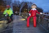 A 15ft version of The Elf on the Shelf has started to appear on buildings around Bristol city centre
