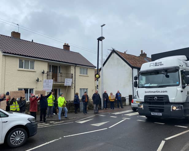 Protestors stand up against traffic coming through Banwell