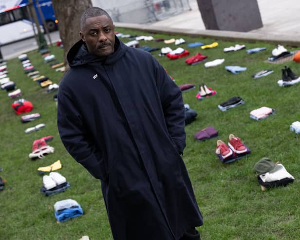 Idris Elba stands in front of an installation of over 200 bundles of clothing representing the lives lost to Knife crime in the UK as he calls on the Government to take immediate action to prevent serious youth violence at Parliament Square on January 08, 2024. (Photo by Jeff Spicer/Getty Images for Don't Stop Your Future)