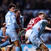 Rob Dickie heads Bristol City level against Coventry