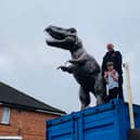 The dinosaur sculpture, Ben Maddocks and his son Noah