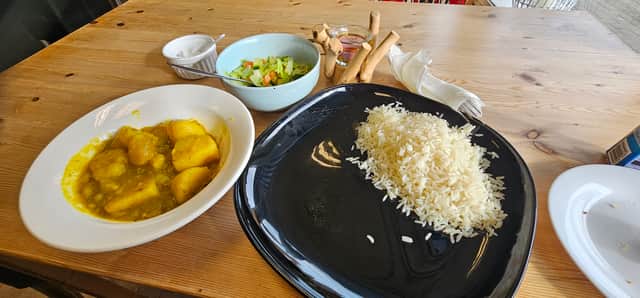 Turmeric potatoes curry and rice with a salad from the specials board