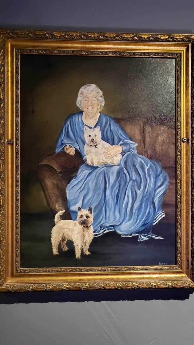 A portrait of former landlady Maud hangs in the bar