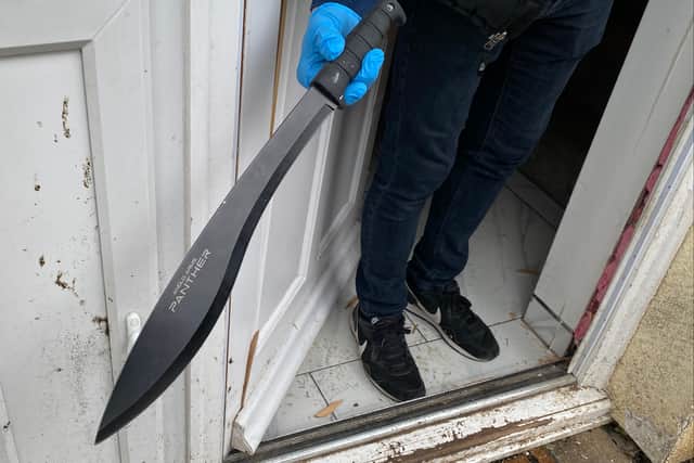 Another one of the large knives recovered during the raid 