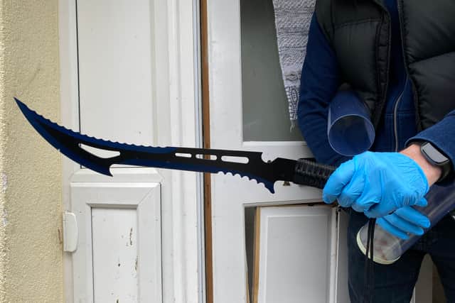 A large zombie knife was among the weapons recovered at the properties raided 