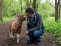 David Hughes takes his pet goat Boo for a walk around their home in Milton Keynes. 