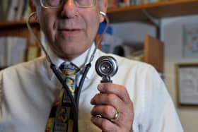 Dr Laurence Buckman poses with a stethoscope in his practice room at the Temple Fortune Health Centre GP Practice near Golders Green, London.