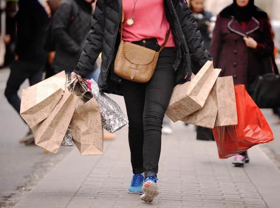 File photo dated 06/12/11 of a person carrying shopping. The decline in shop prices slowed in September in "clear signs" that rising commodity and transport costs, labour shortages and Brexit red tape are filtering through to consumers, figures suggest. Shop prices decreased by 0.5 percent year-on-year from 0.8 percent in August, according to the BRC-NielsenIQ index. Issue date: Wednesday September 29, 2021.