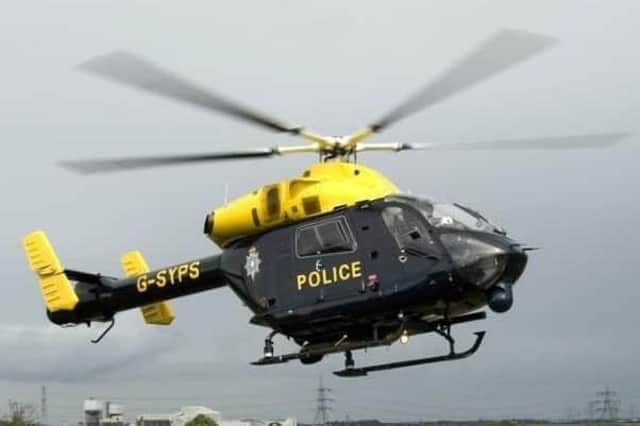A police helicopter was scrambled above Kingswood after a member of the public reported seeing a moped driver carrying a firearm. 