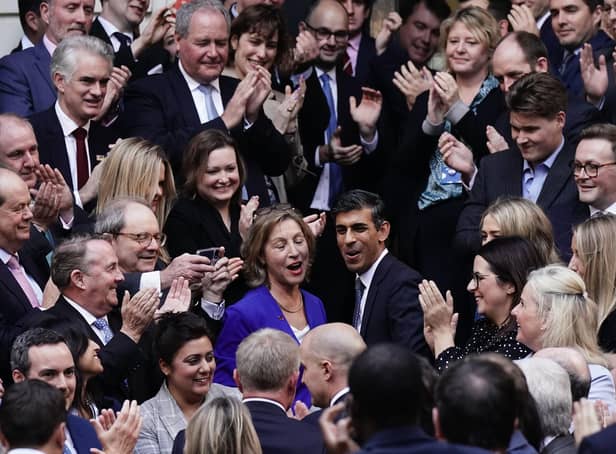 <p>Rishi Sunak is congratulated as he arrives at Conservative party HQ in Westminster, London, after it was announced he will become the new leader of the Conservative party after rival Penny Mordaunt dropped out.</p>