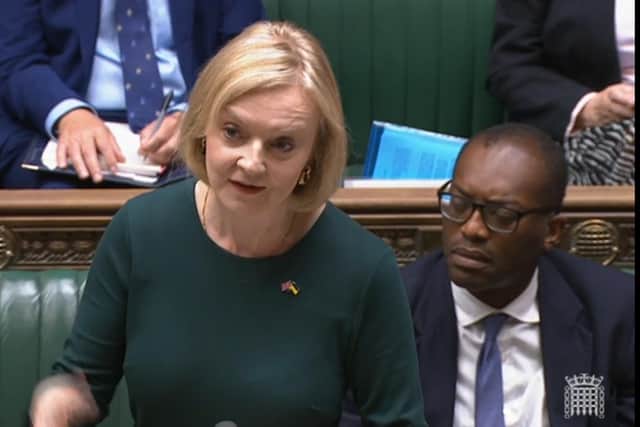 Prime Minister Liz Truss, expected to reveal details of the support package this week, speaks in the House of Commons alongside Chancellor Kwasi Kwarteng