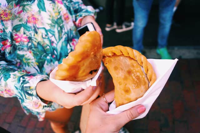 Eating empanadas on the food and cultural tour in Little Havana. Image: Picasa