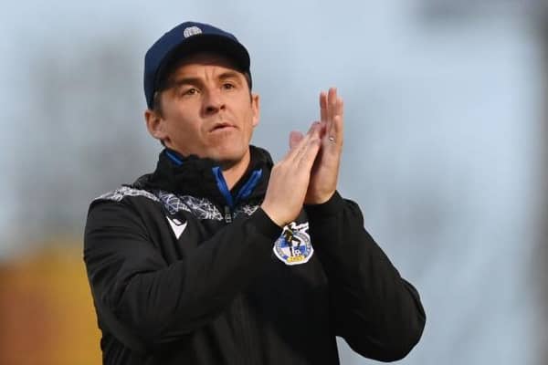 BRISTOL, ENGLAND - APRIL 18: Joey Barton, Manager of Bristol Rovers, applauds their fans. (Photo by Dan Mullan/Getty Images)