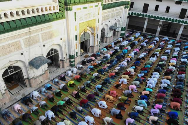 Muslim devotees offer a special prayer on the occasion of Eid-Al-Fitr festival, which marks the end of Ramadan. (Pic credit: Narinder Nanu / AFP via Getty Images)