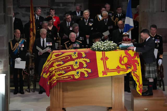 King Charles III and members of his family look on as the Duke of Hamilton places the Crown of Scotland on Queen Elizabeth II's coffin. Picture: Aaron Chown/WPA Pool/Getty