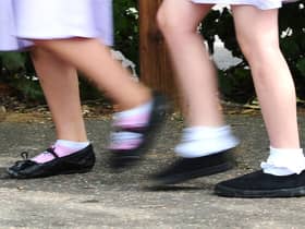 File photo date 15/07/14 of a generic stock photo of school girls walking to school. Many children are not ready to start school when they first enter a classroom, a poll of headteachers suggests.