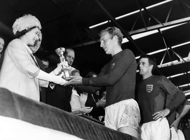 Queen Elizabeth II presents the World Cup to England captain at Wembley in 1966. Photo:  AFP via Getty Images.